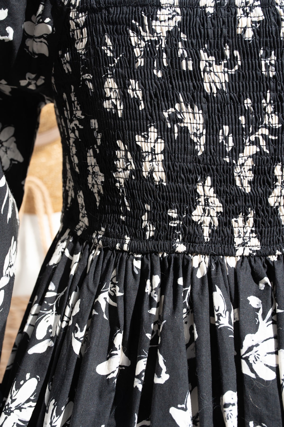 Black floral patterned dress with smocked waist
