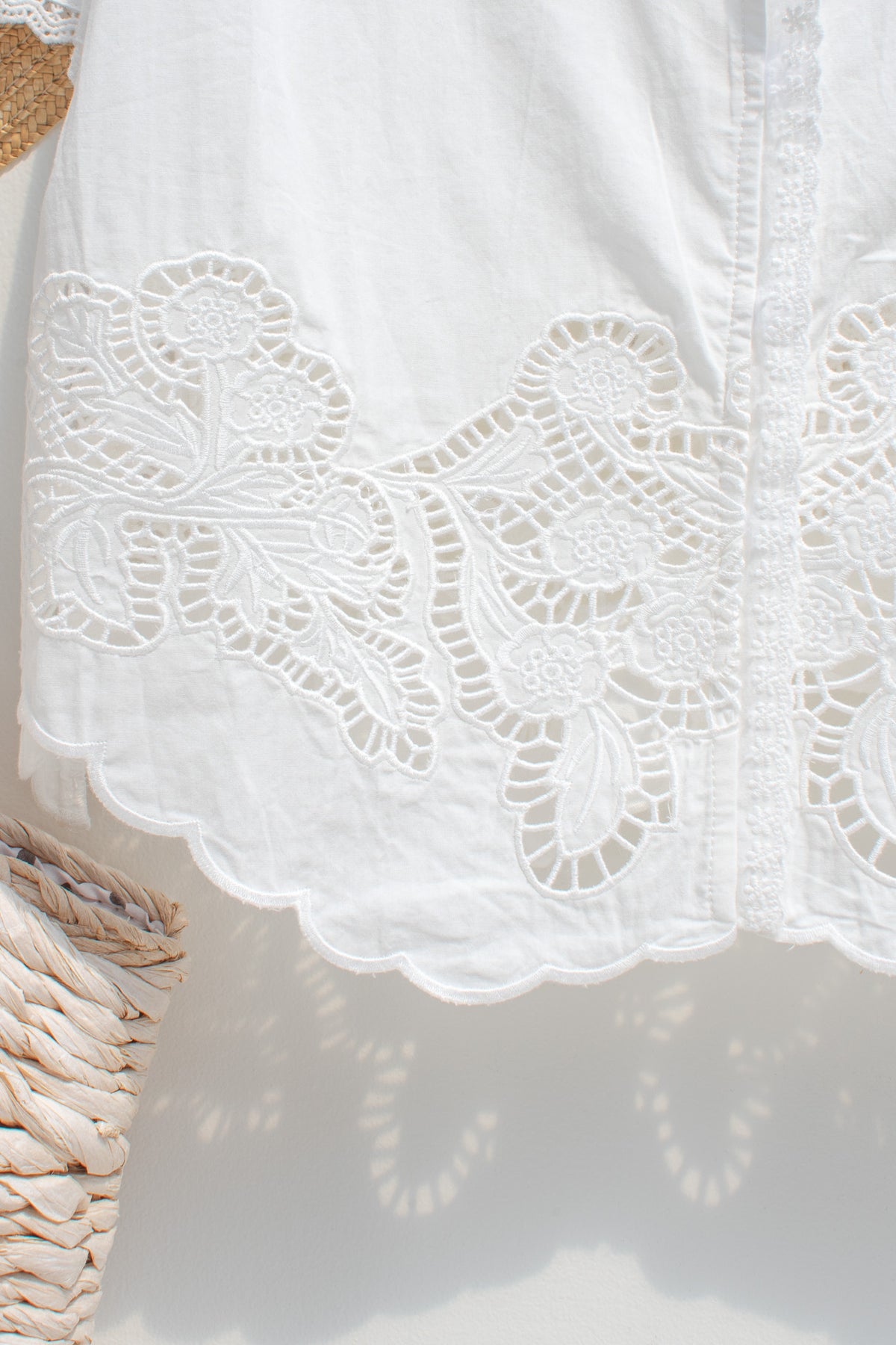 close up of cutout lace hem and cotton fabric