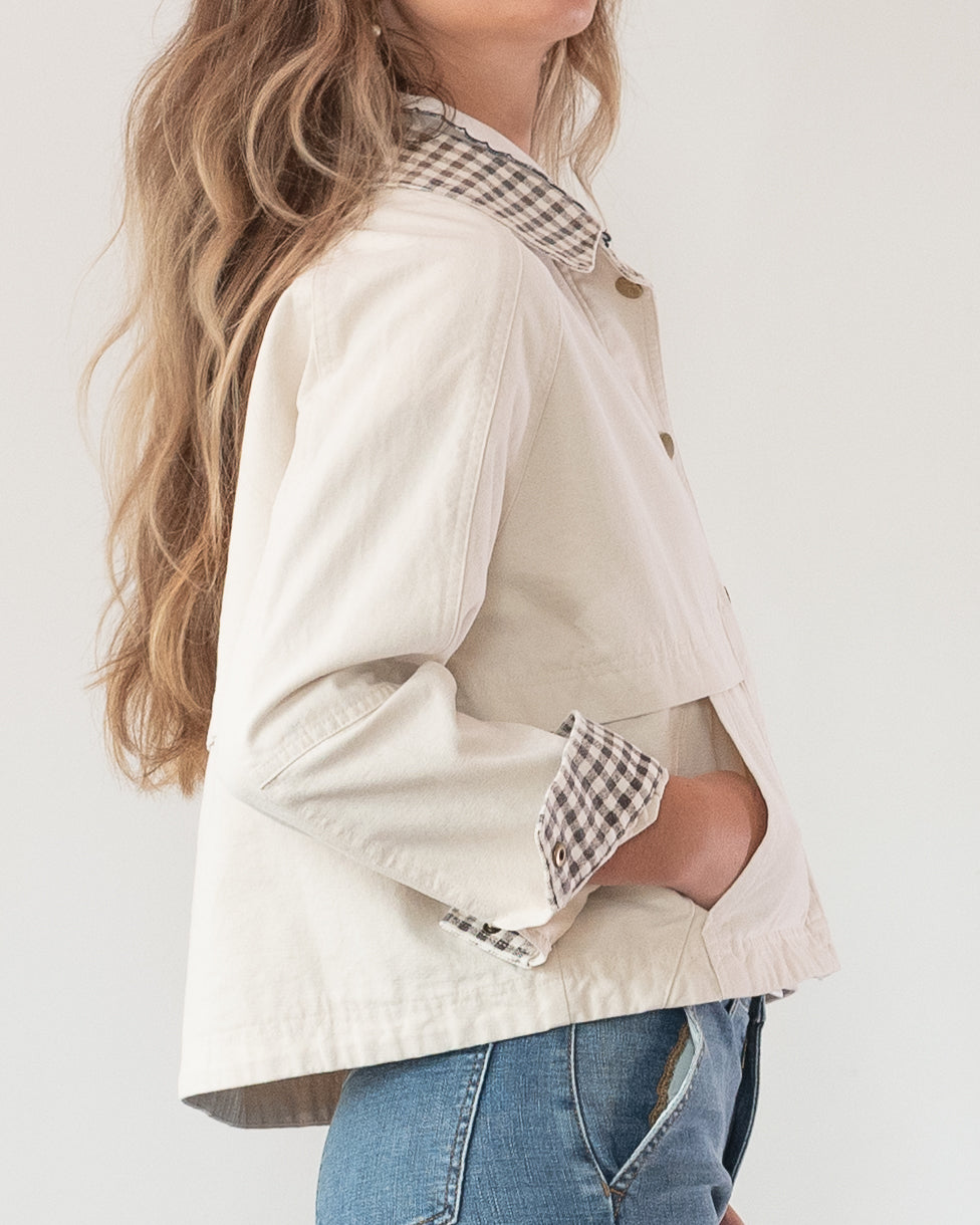 Feminine style cream jacket with gingham collar and sleeve detail. French girl style feminine clothing.