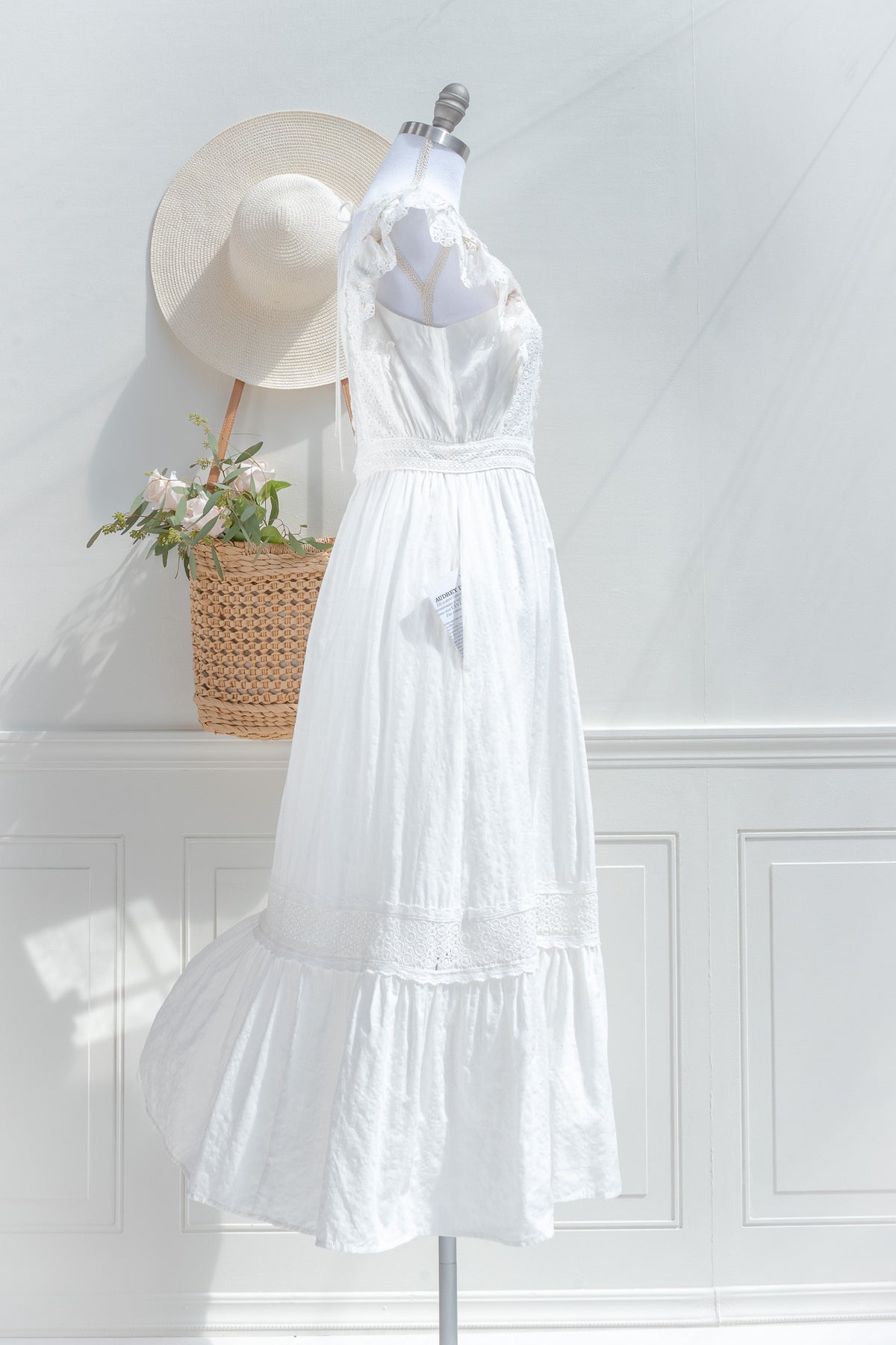 White cotton midi dress with lace waist detail and soft silhouette side view