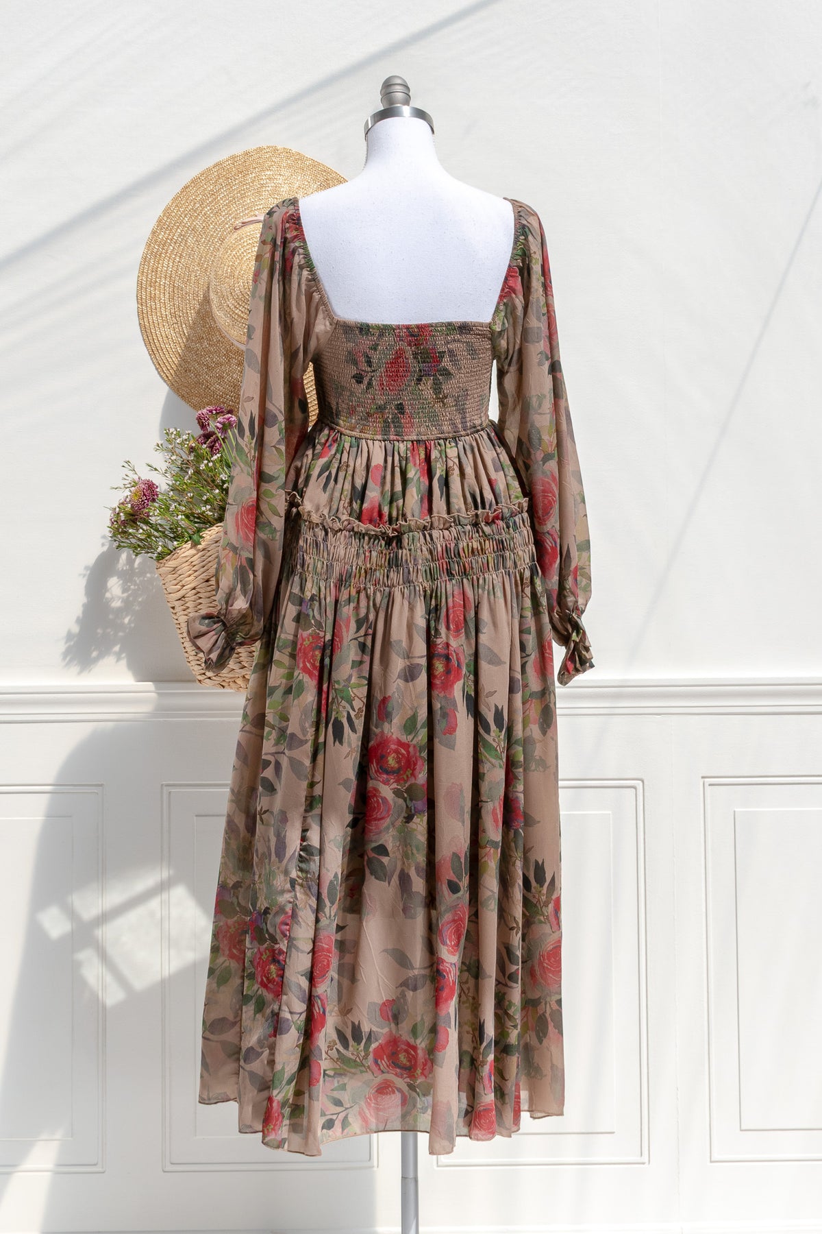 Hazel rose chiffon midi dress — back view with smocked waist and soft movement