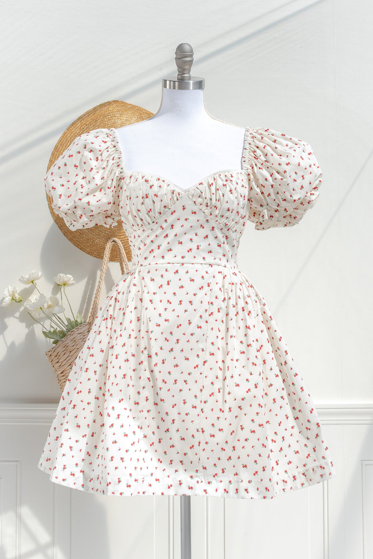 Cream floral rayon mini dress with puff sleeves and structured bust front view