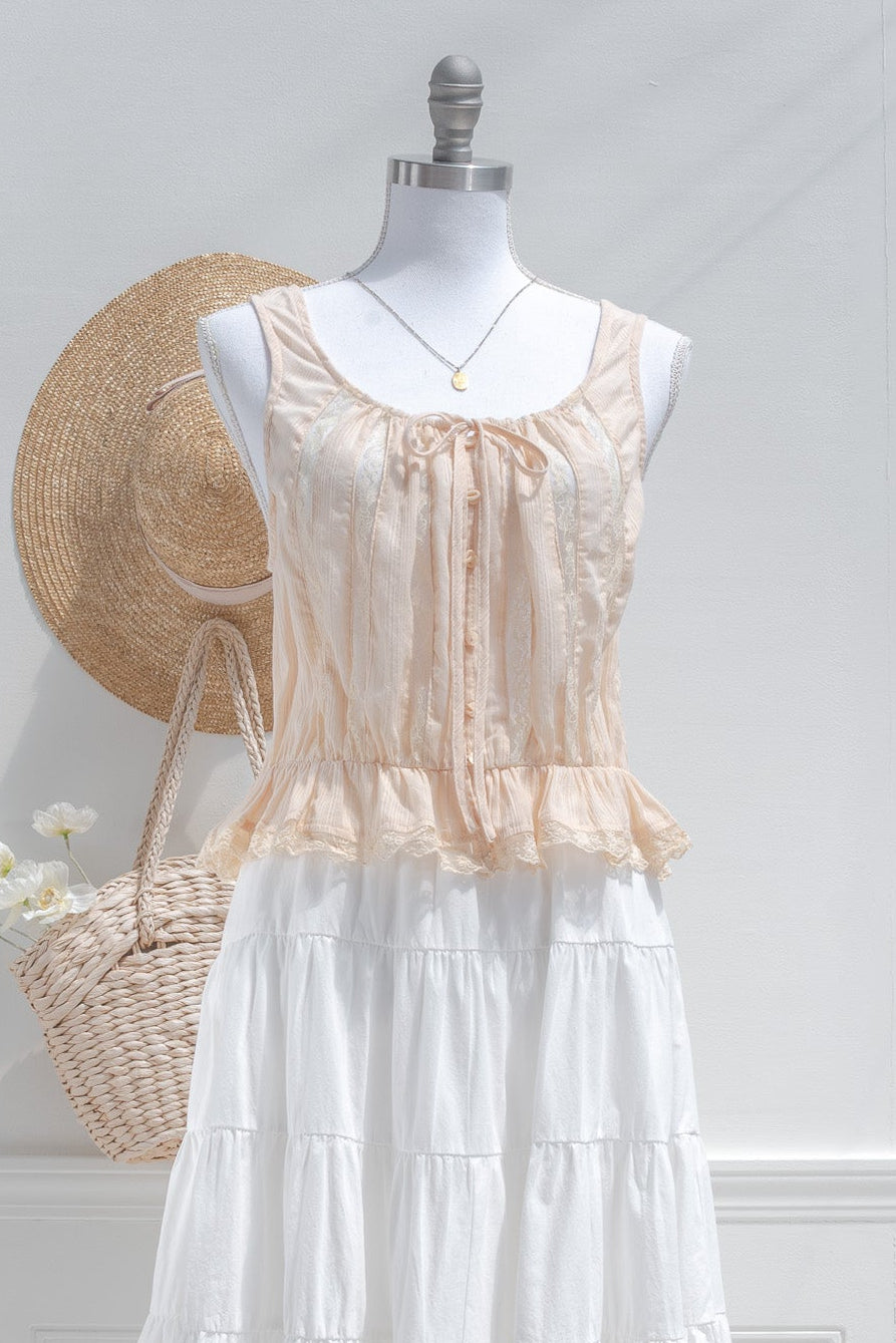 Beige cotton chemise top styled with white tiered midi skirt and lace ruffle hem front view.