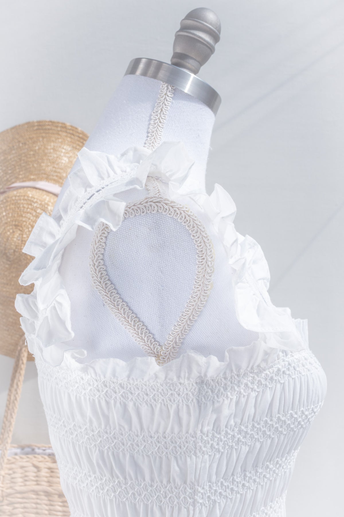 Ruffled strap detail on white cotton smocked midi dress