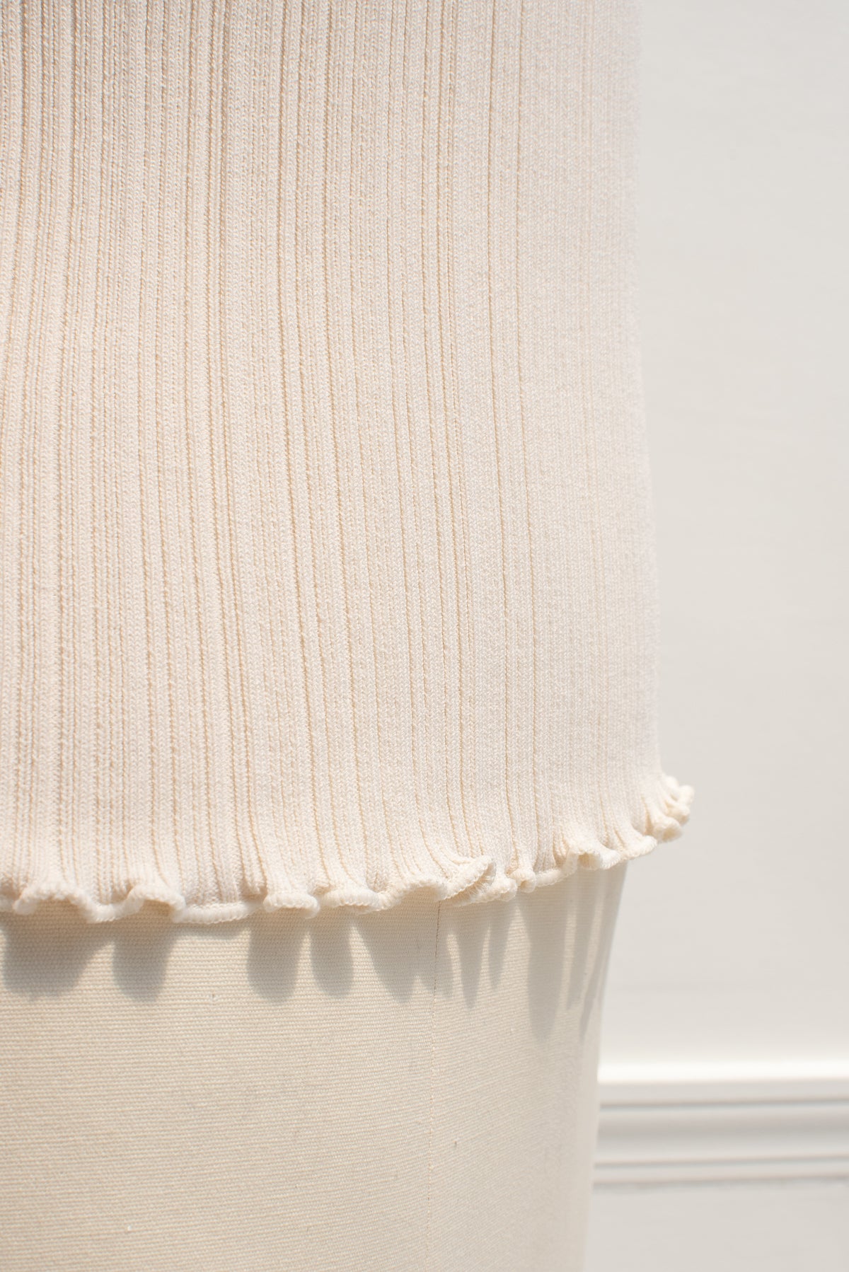 Detail of the ribbed knit hem.