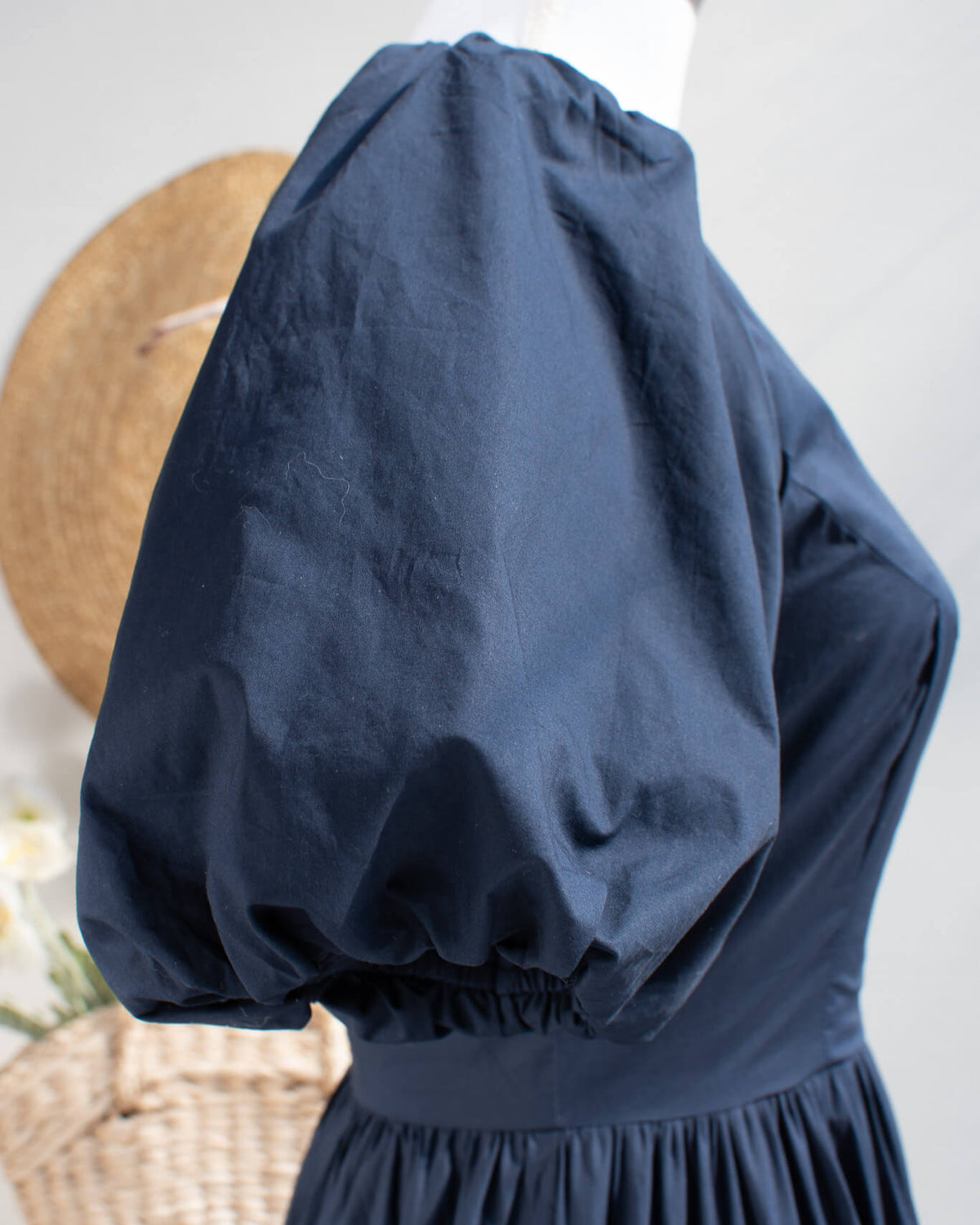 Dramatic puff sleeve detail on Abby navy dress
