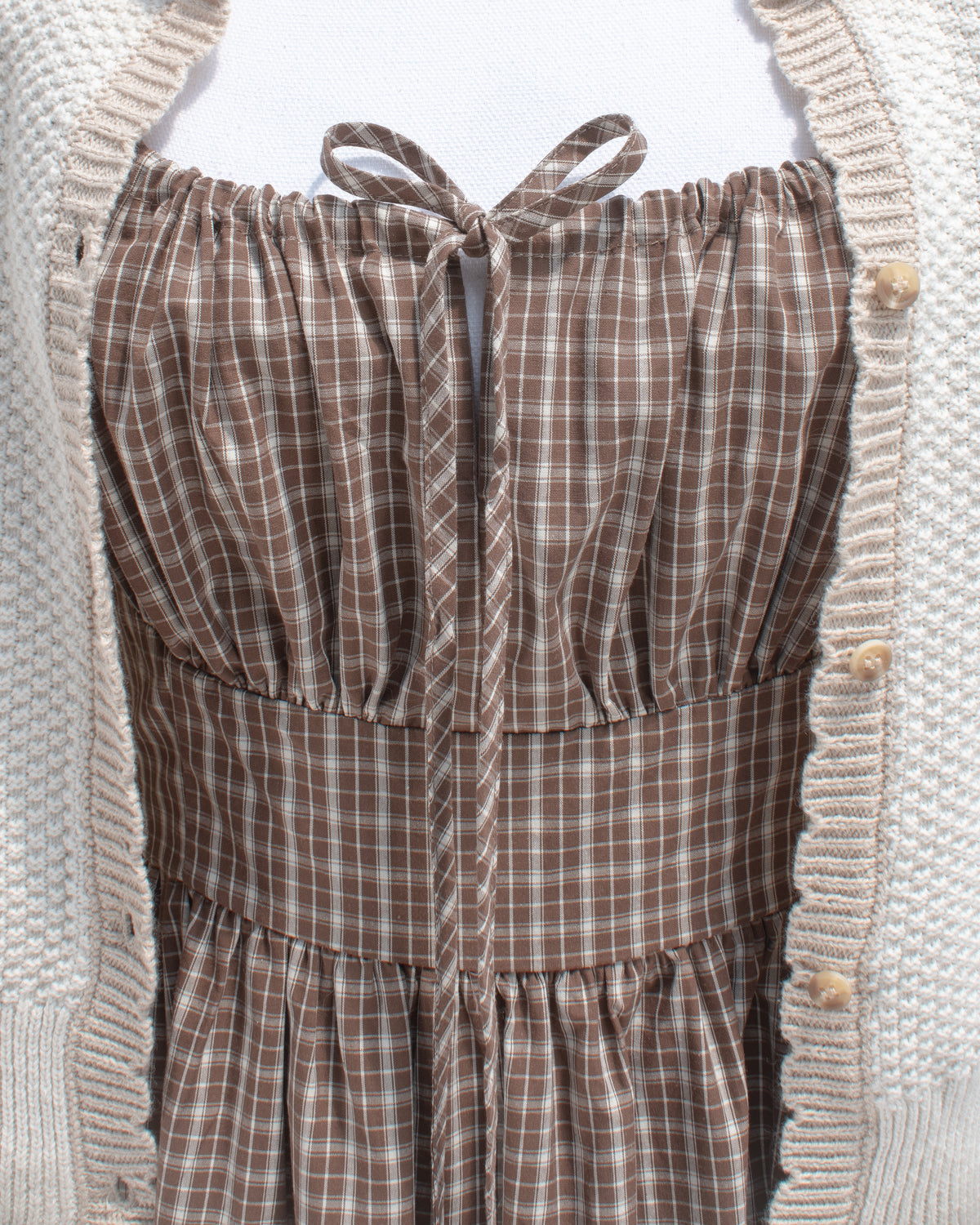 bust detail of brown midi dress. romantic french style.