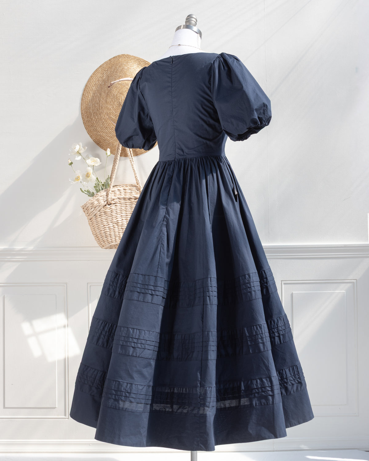blue dress with puff sleeves and side pocket.