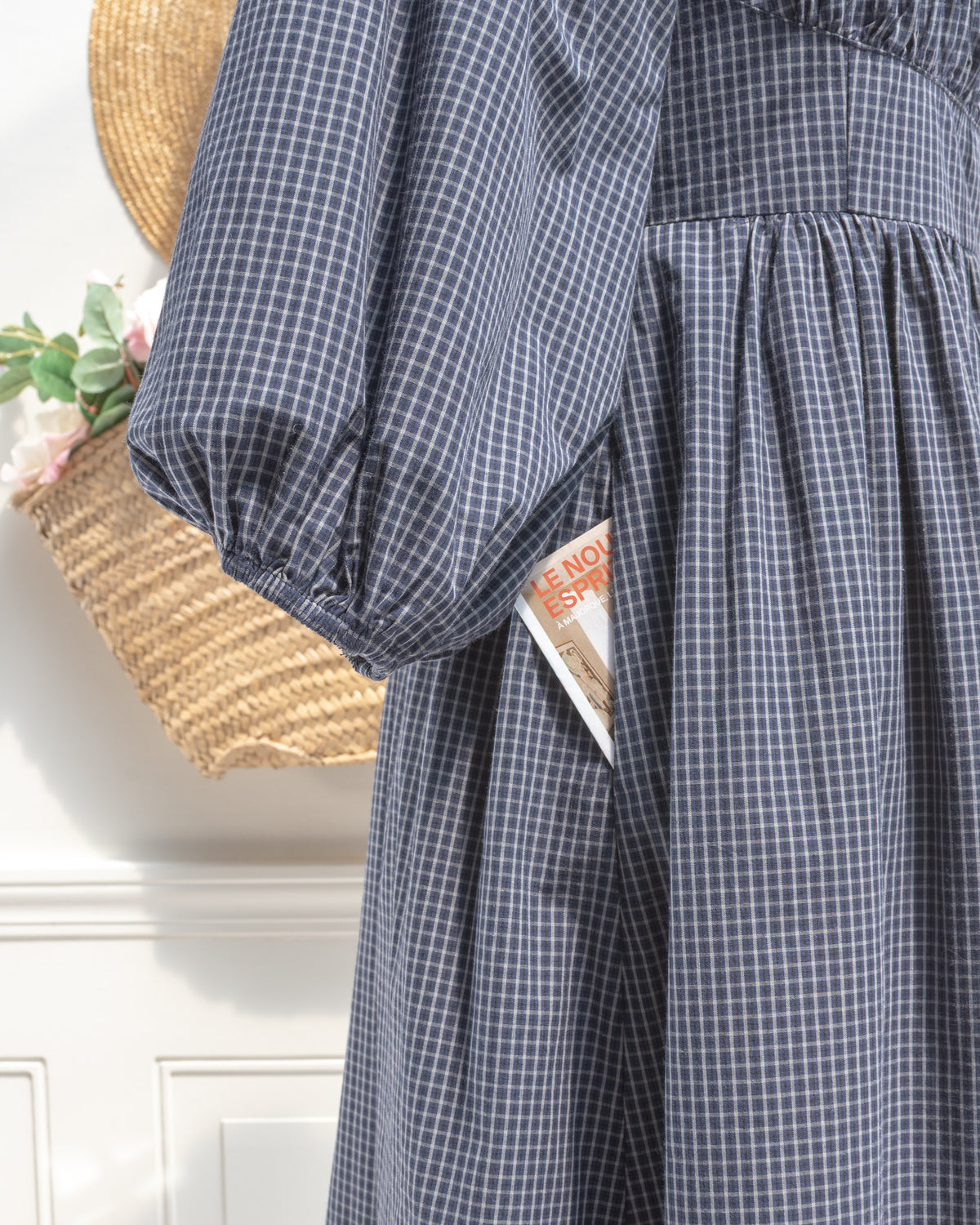 Navy check cotton midi dress with elastic sleeve cuff and side seam pocket, close detail view.