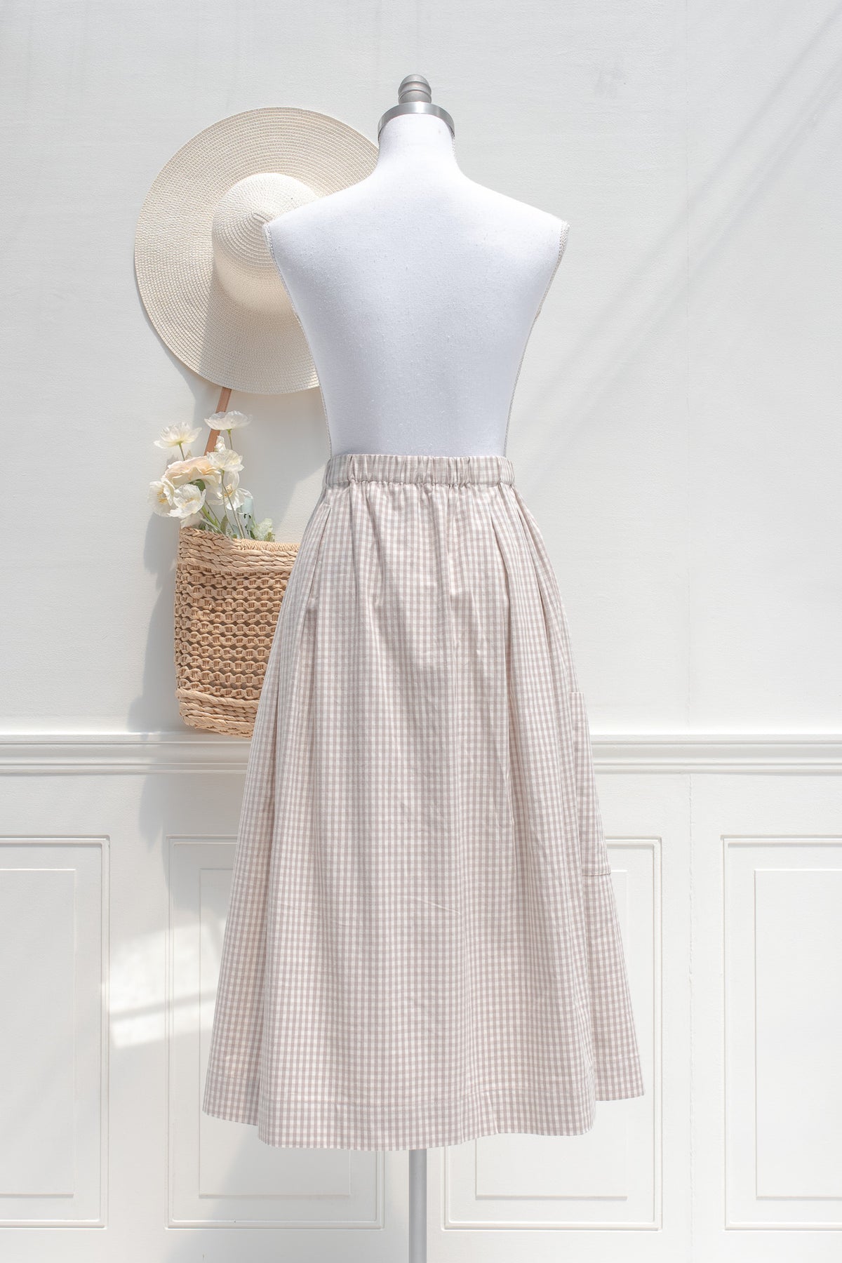 Taupe and white gingham cotton midi skirt with elastic waistband, back view.