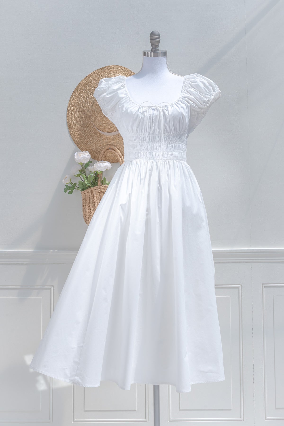 White cotton chemise midi dress with smocked waist and gathered cap sleeves, front view.