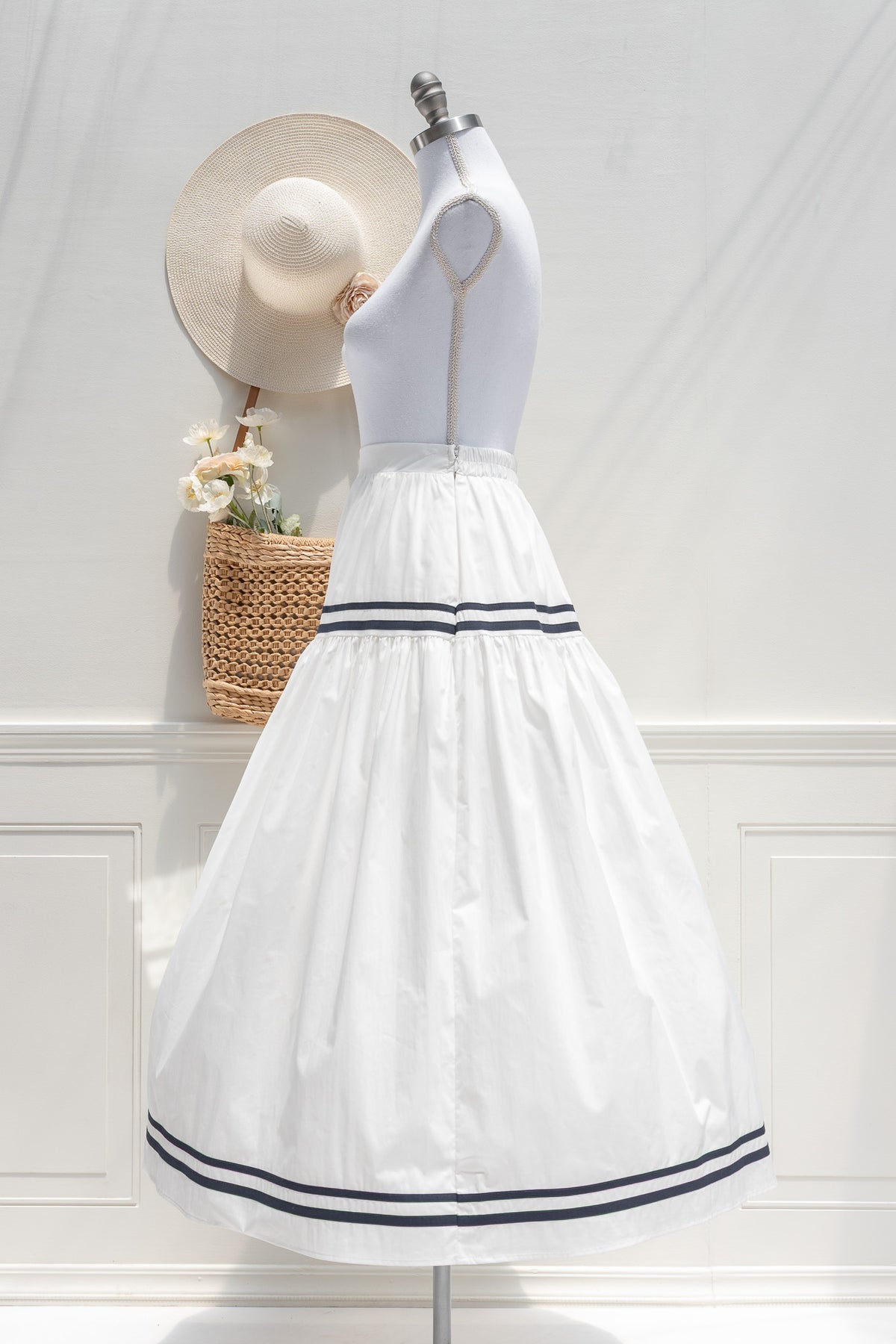 White cotton navy stripe midi skirt, side view.