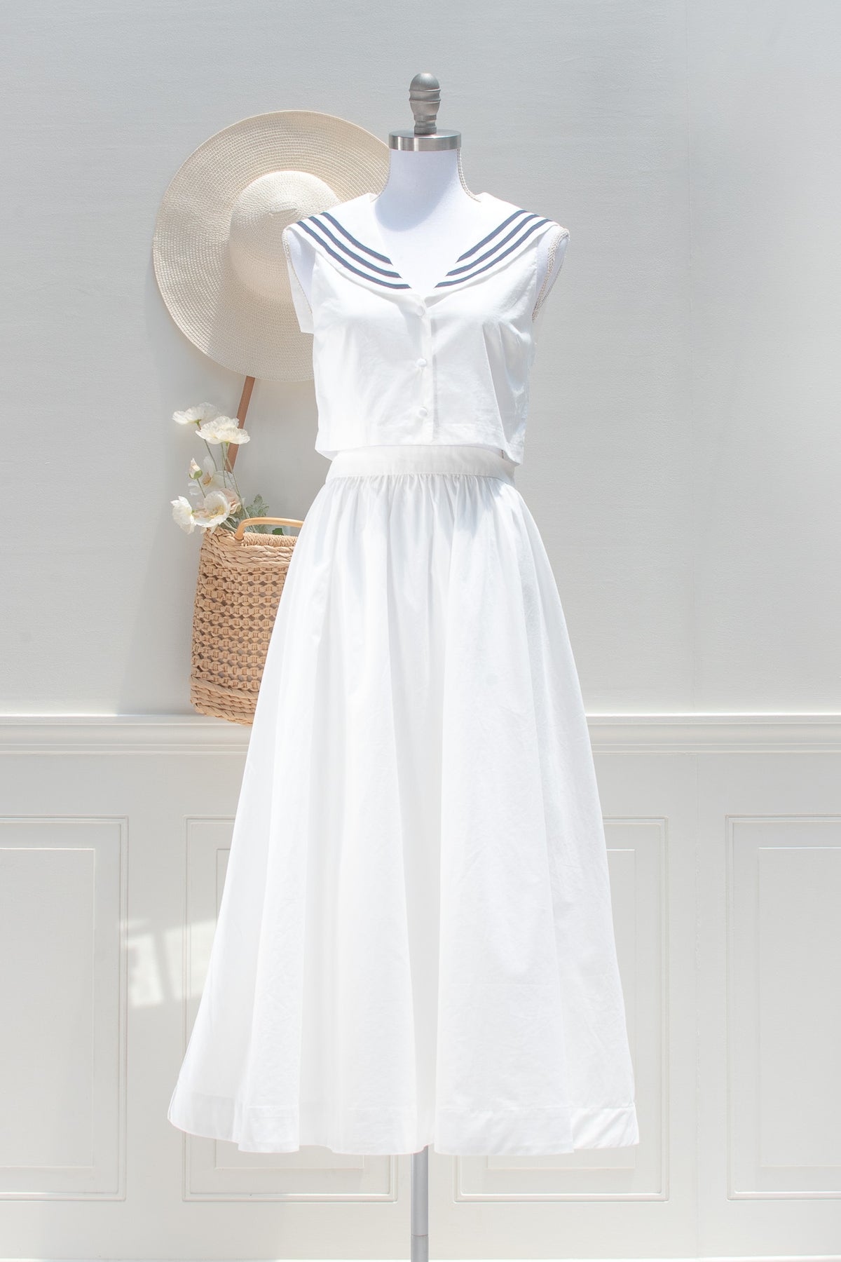 White sailor set with navy striped collar crop top and full midi skirt, front view.