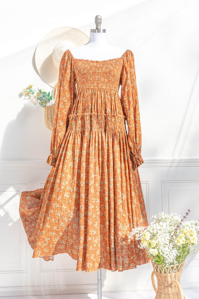 Smocked floral midi dress with long sleeves — square neckline