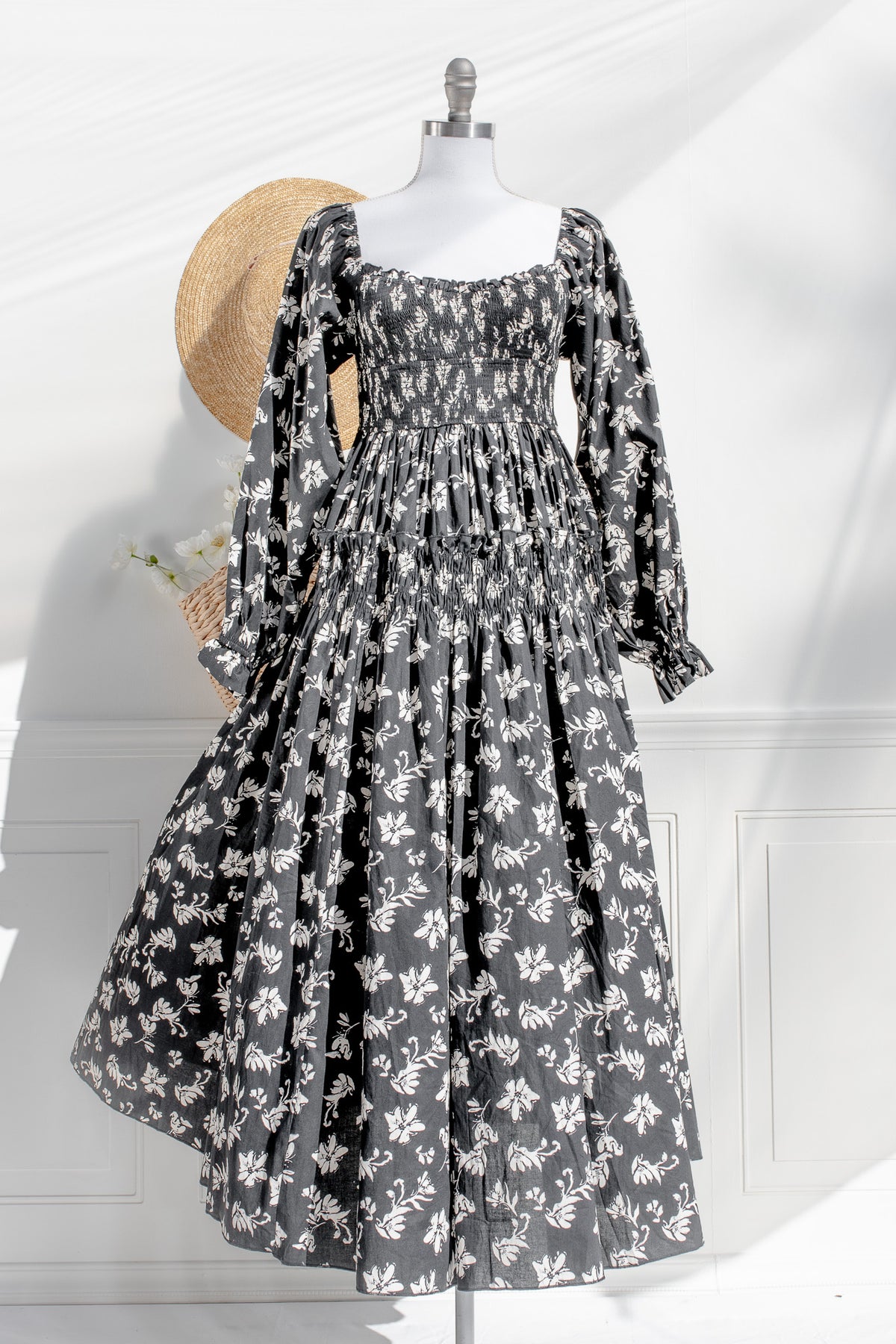Floral dress on a mannequin with a white background