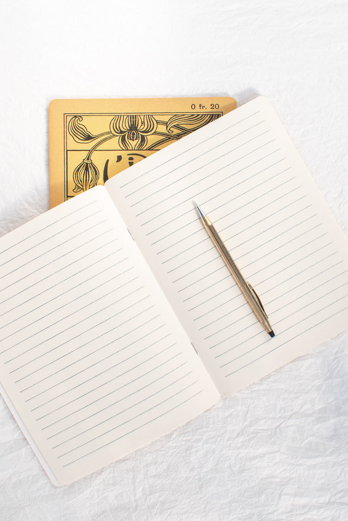 french vintage style notebook. yellow art deco style. 