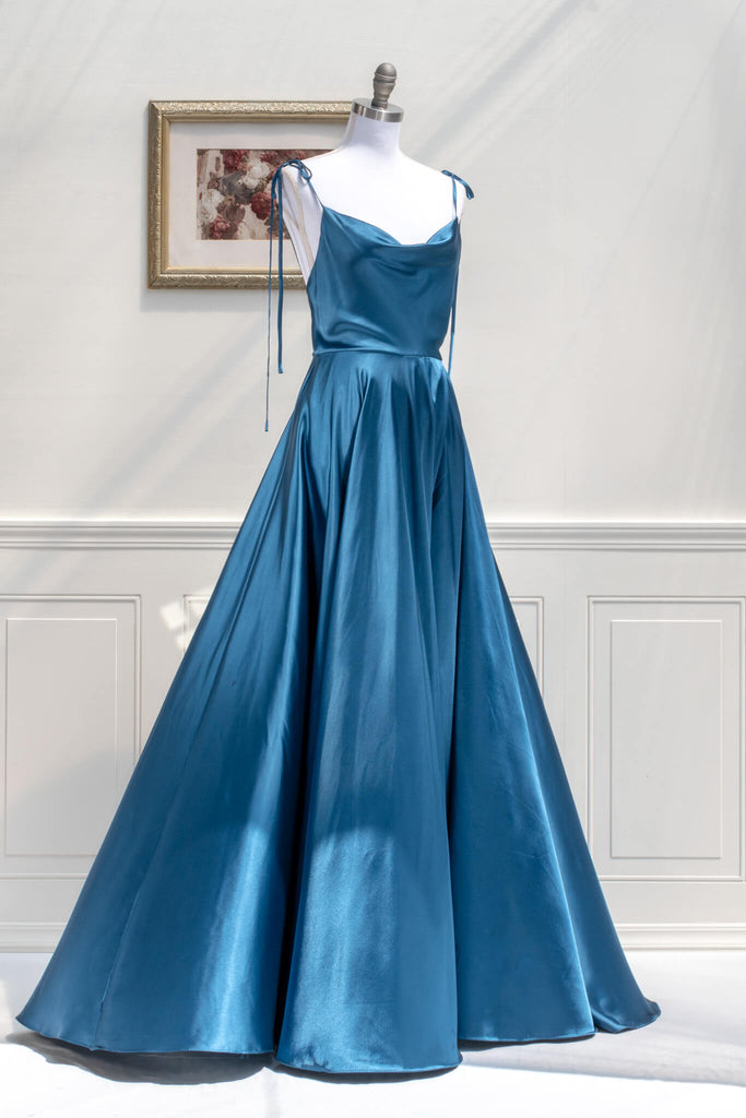 affordable formal gown for events. a long sapphire blue elegant formal dress with cowl neck and spaghetti straps. FRont view. Amantine. 