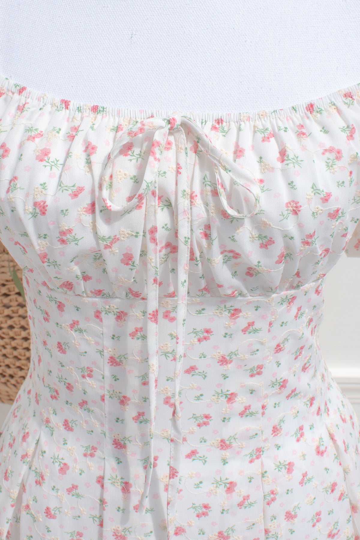 Fitted bodice detail on white floral cotton midi dress