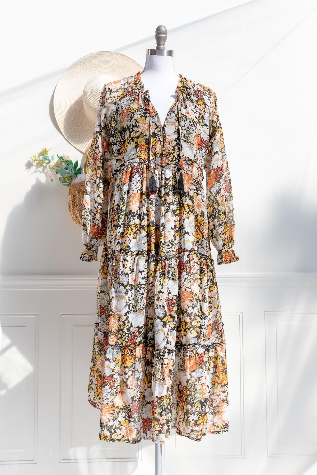 Jardin d’Automne floral tiered midi dress in black multi — front view with tie neckline