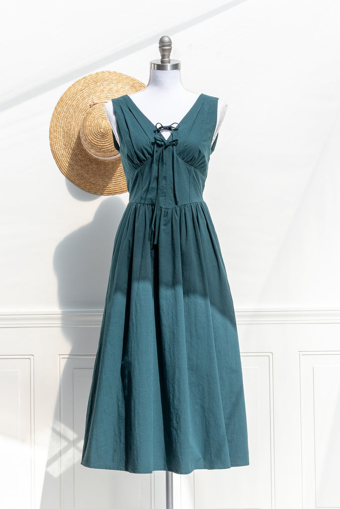 Amantine Nora V-neck midi dress in deep turquoise green cotton with waist-defining fit and A-line skirt — front view