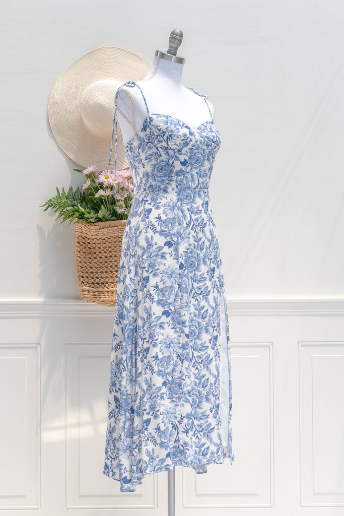 feminine french style dress - a beautiful blue floral on white dress. sweetheart neckline, spaghetti dress, perfect for summer brunches, dates, and even for workwear. 3/4 side view. amantine.
