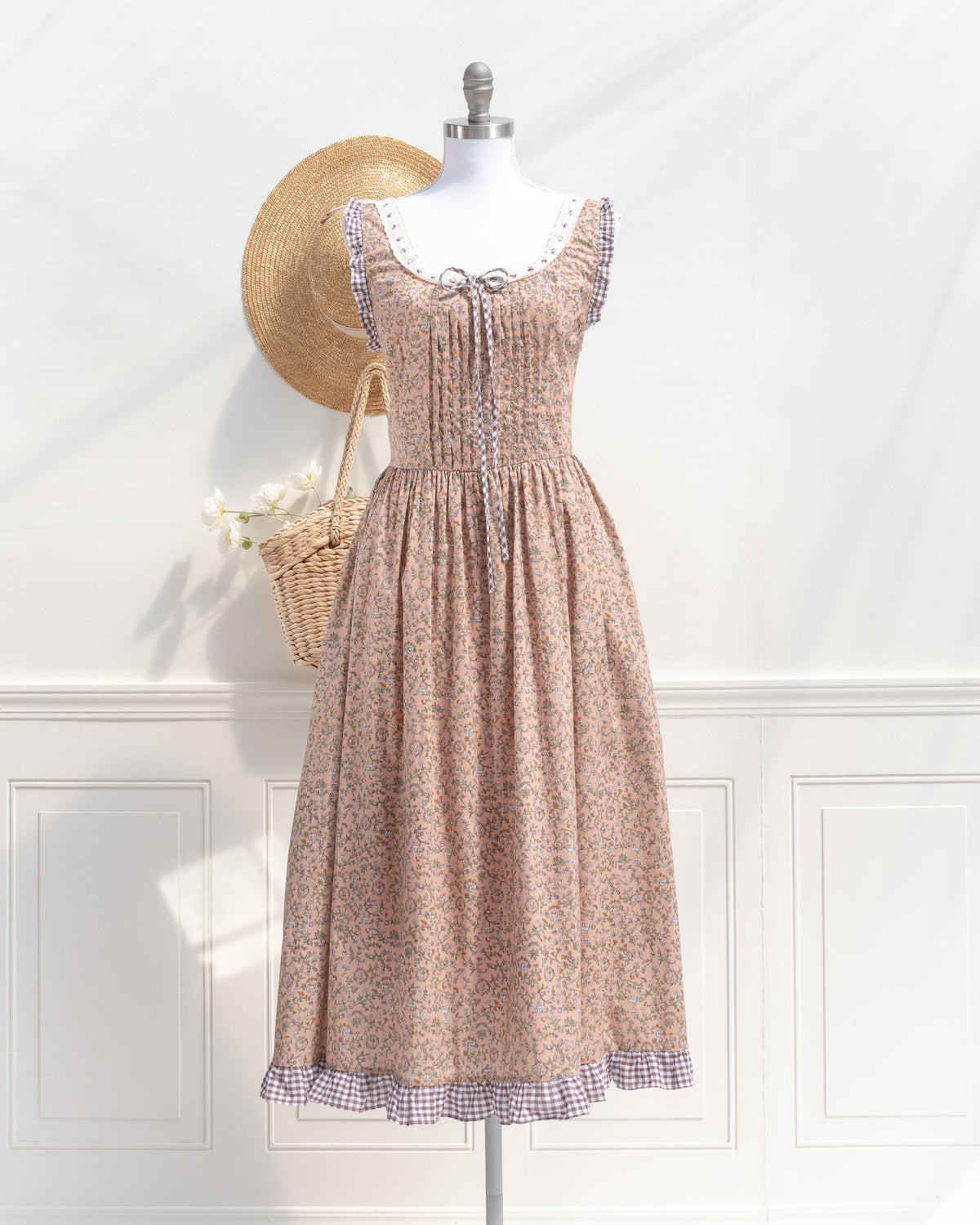 Blush floral print corset back dress shown on a mannequin, a vintage-inspired French girl essential.