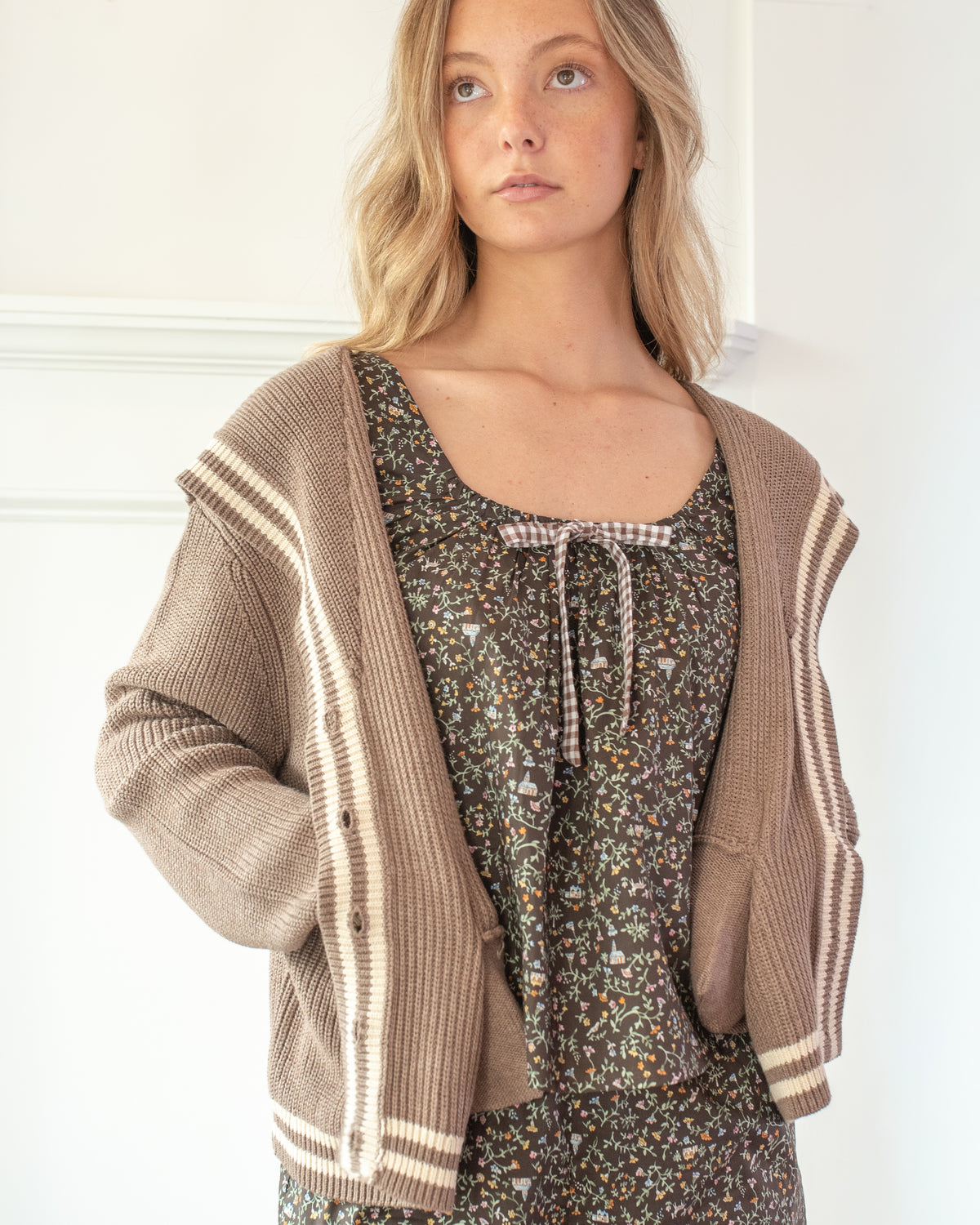 Brown striped cardigan with sailor collar shown on a model front view.