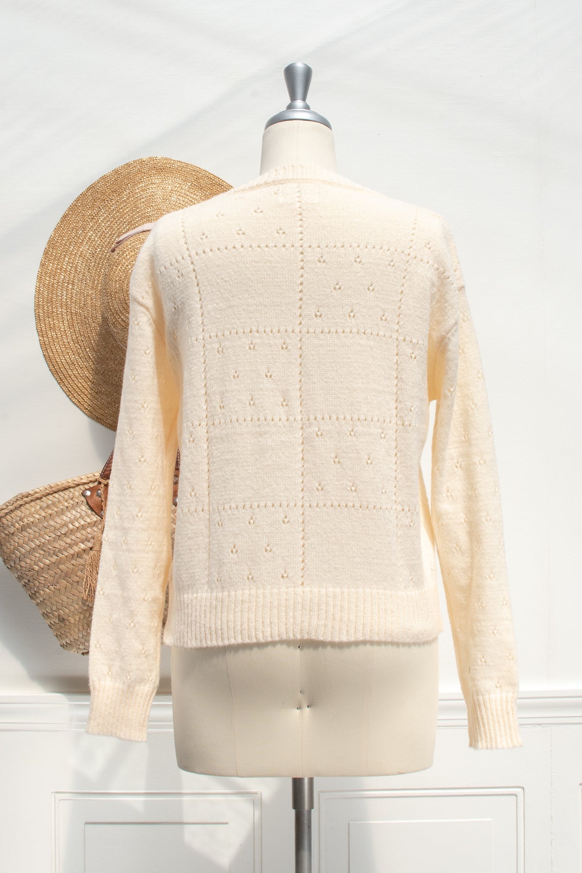 Buttercream knit rose cardigan, a wardrobe staple, back view.