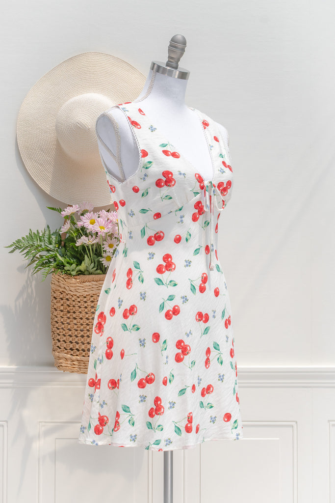 cherry print mini dress. amantine. 3/4 side view. 