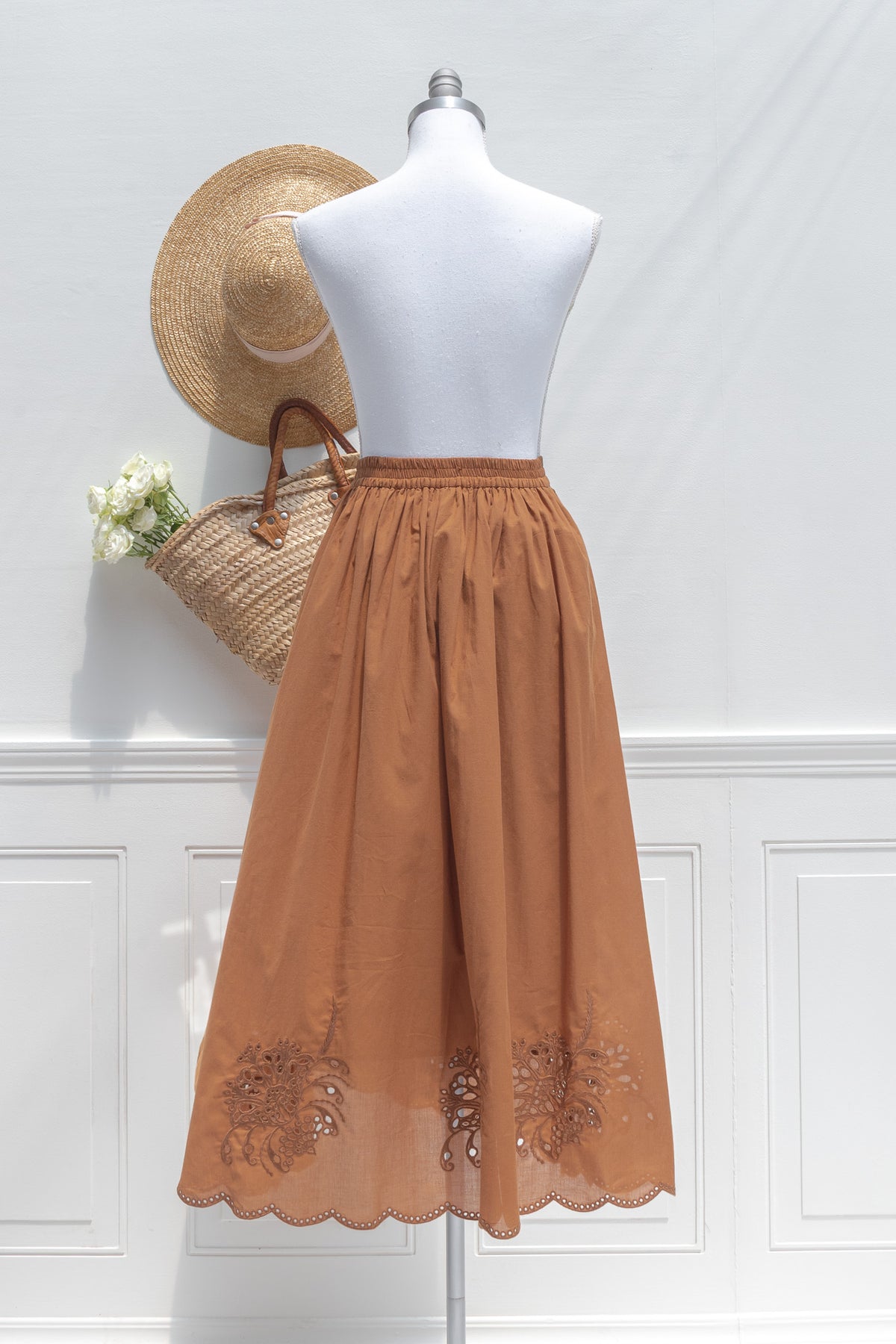 Chestnut cotton midi skirt with a full silhouette, shown on a mannequin, back view.