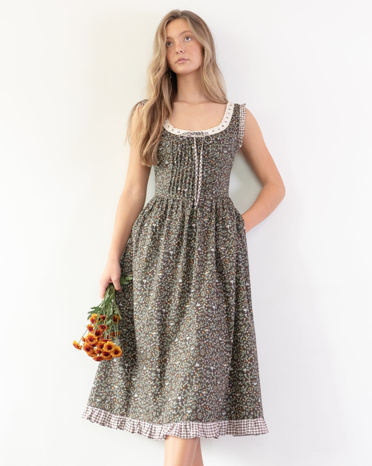 Chocolate brown floral print corset back dress worn by a model, a vintage-inspired French girl essential.