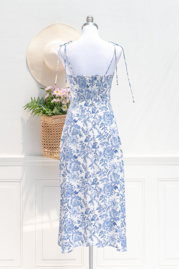 feminine french style dress - a beautiful blue floral on white dress. sweetheart neckline, spaghetti dress, perfect for summer brunches, dates, and even for workwear. back view. amantine.