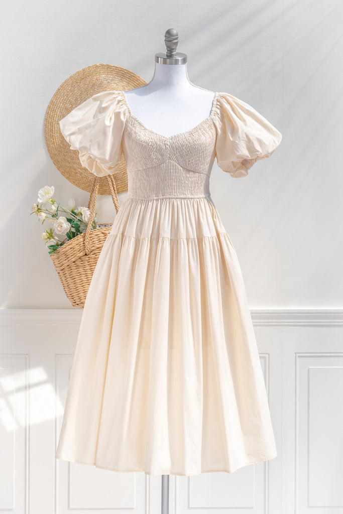 cottagecore dresses collection. a beautiful cottage core style dress with a sweetheart neckline, short puff sleeves, ruched bodice, side seam pockets, and a line skirt. perfect for easter and spring. front view. amantine. 