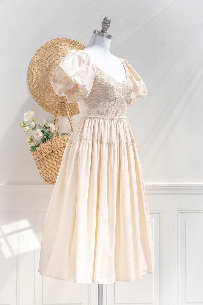 cottagecore dresses collection. a beautiful cottage core style dress with a sweetheart neckline, short puff sleeves, ruched bodice, side seam pockets, and a line skirt. perfect for easter and spring. 3/4 side view. amantine. 