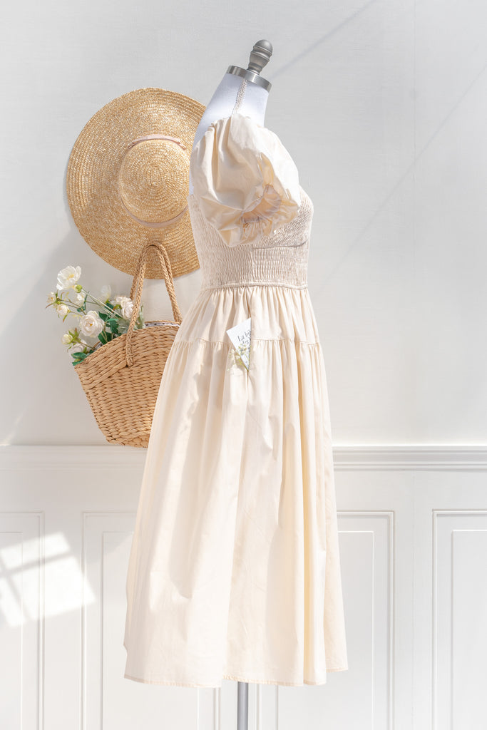 cottagecore dresses collection. a beautiful cottage core style dress with a sweetheart neckline, short puff sleeves, ruched bodice, side seam pockets, and a line skirt. perfect for easter and spring. side view. amantine. 
