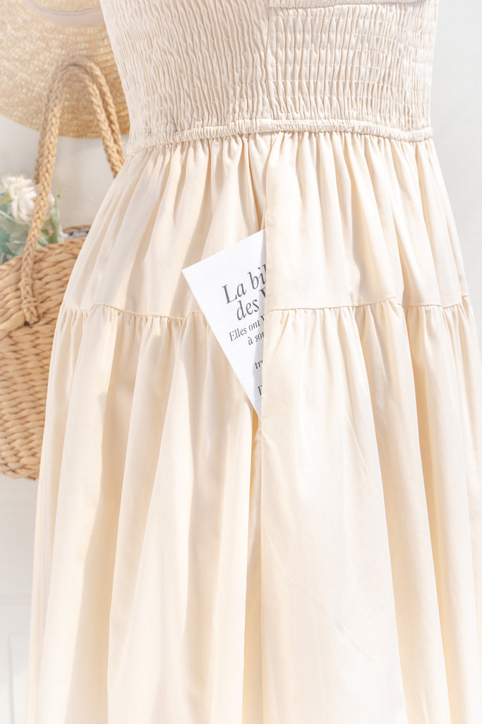 cottagecore dresses collection. a beautiful cottage core style dress with a sweetheart neckline, short puff sleeves, ruched bodice, side seam pockets, and a line skirt. perfect for easter and spring. front view showing side seam pocket up close. amantine. 