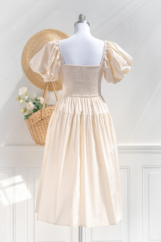 cottagecore dresses collection. a beautiful cottage core style dress with a sweetheart neckline, short puff sleeves, ruched bodice, side seam pockets, and a line skirt. perfect for easter and spring. back view. amantine. 
