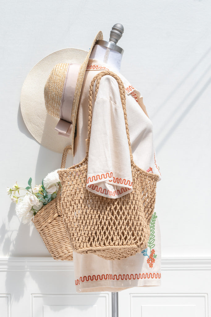 feminine clothing - a very unique summer set featuring a short sleeve button down shirt and shorts. In cream linen blend, it features very cute embroidery including a horse, and florals. A beautiful choice for your summer getaways. amantine french style clothing. 