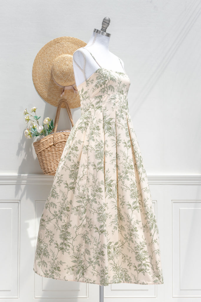 elegant green floral cotton dress - long green floral  dress with spaghetti straps and pleated skirt. french dress. 3/4 side view. 