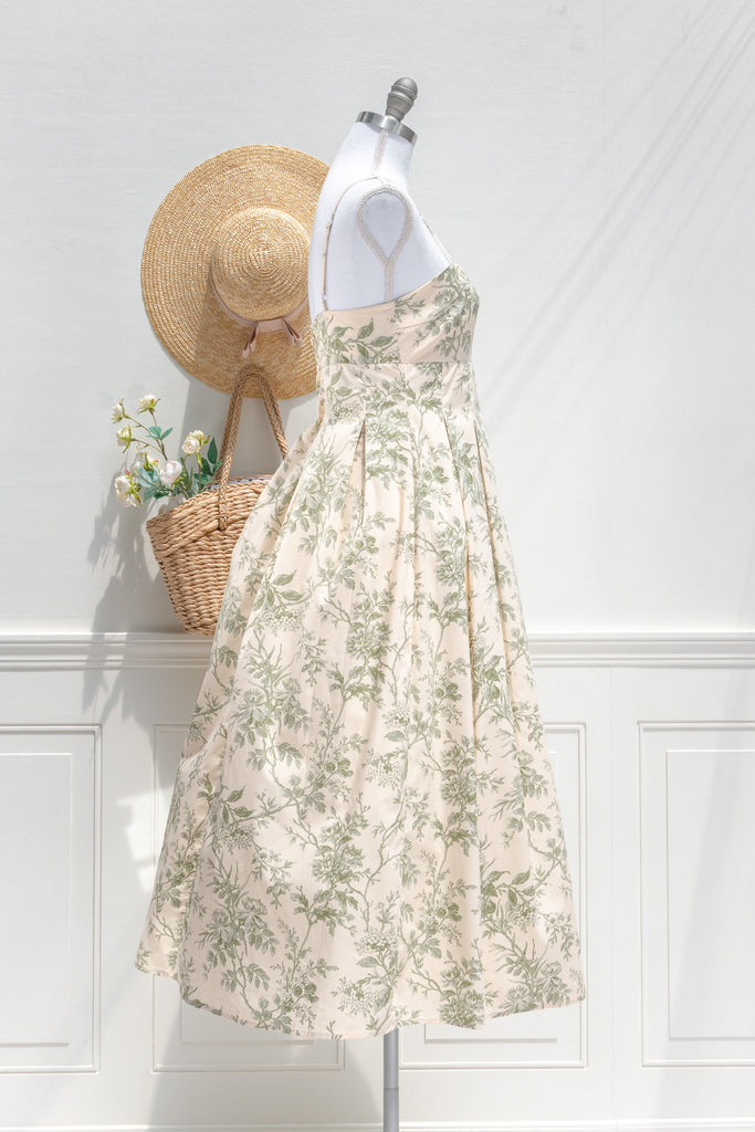 elegant green floral cotton dress - long green floral  dress with spaghetti straps and pleated skirt. french dress. side view. 