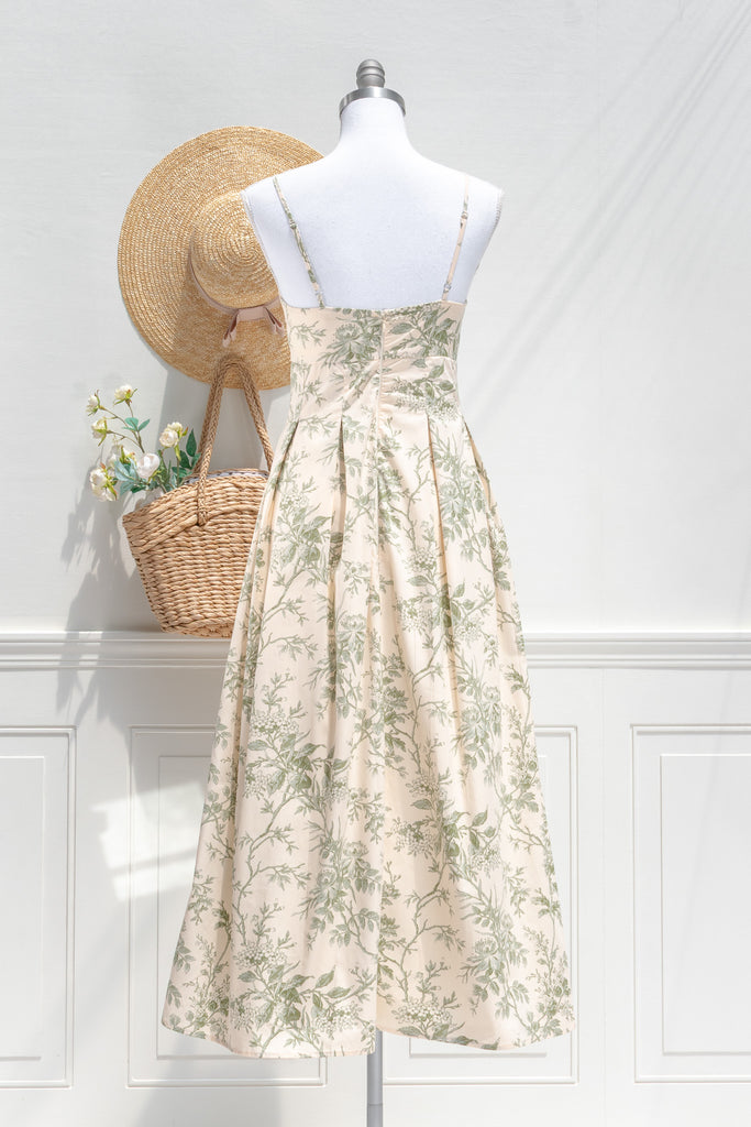 elegant green floral cotton dress - long green floral  dress with spaghetti straps and pleated skirt. french dress. back view. 
