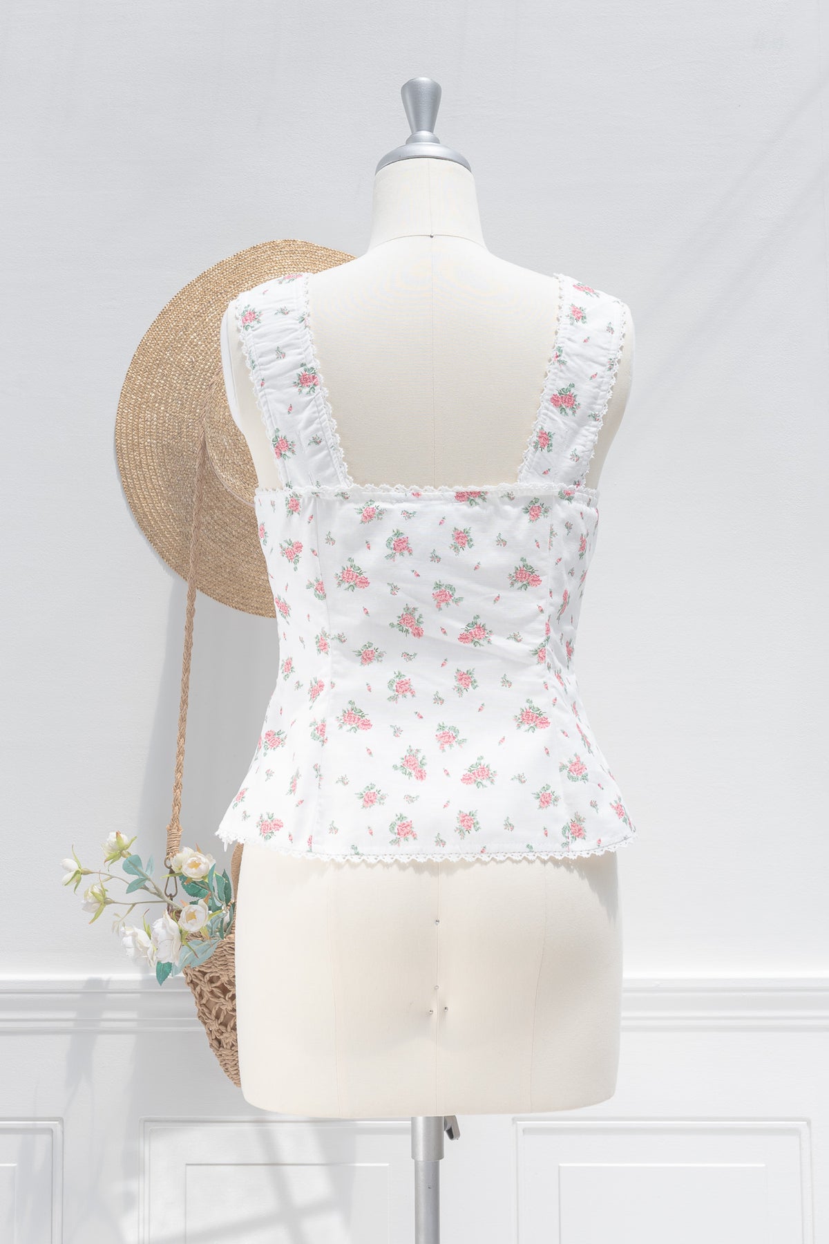 White floral linen cotton bustier top showing ruched straps and scalloped lace hem, back view.