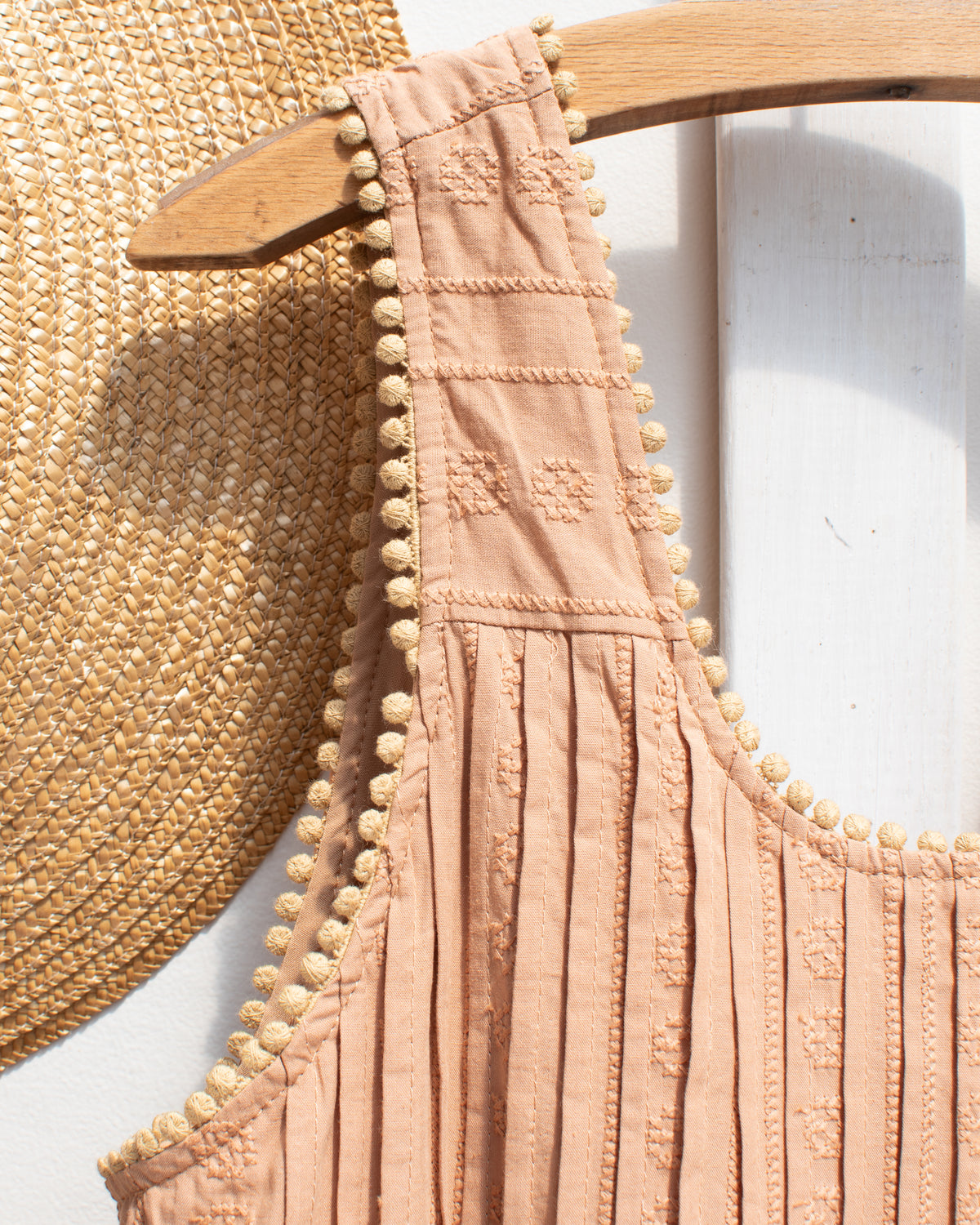 detail of carmeline dress from amantine showing trim detail. 