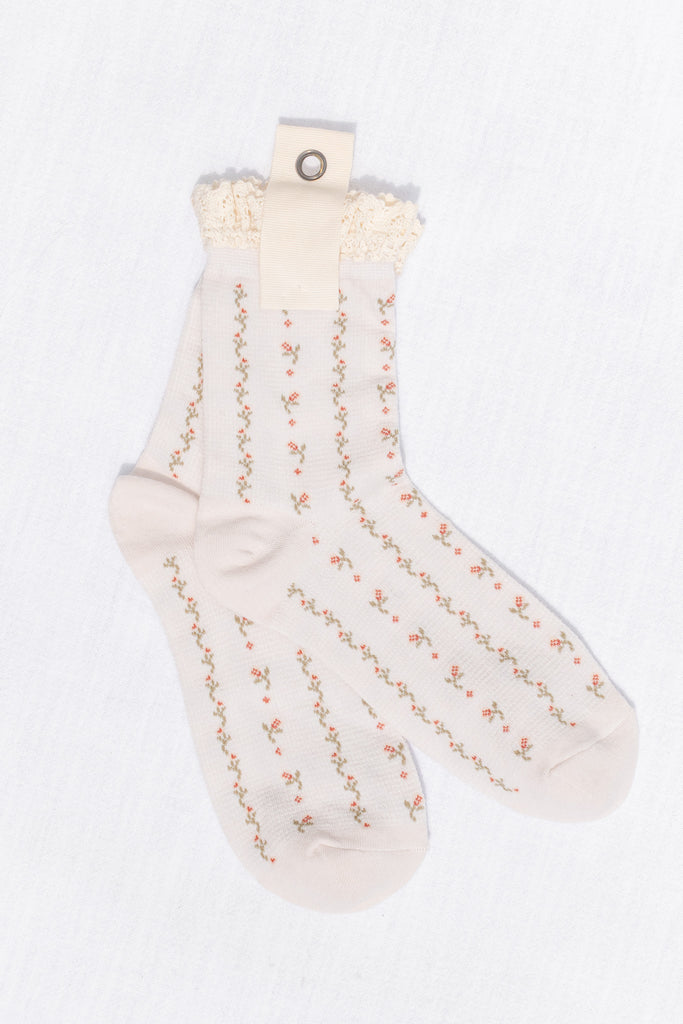 White socks with floral pattern on a white background