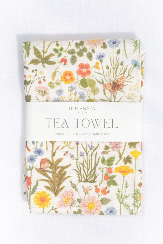 a french kitchen essential - a linen tea towel with a wild flower French cottage garden print motif. the perfect gift for the francophile in your life. 