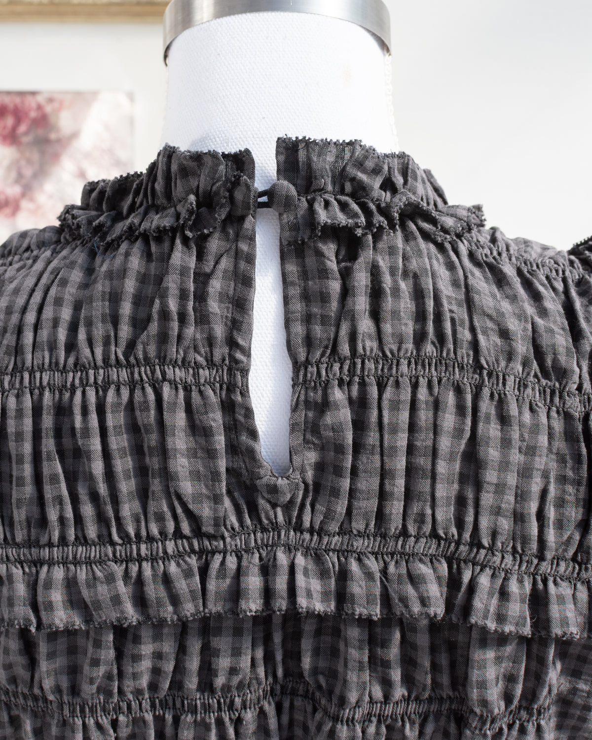 Gray plaid dress with ruffled high neckline and keyhole opening, romantic French girl style, neckline detail view.