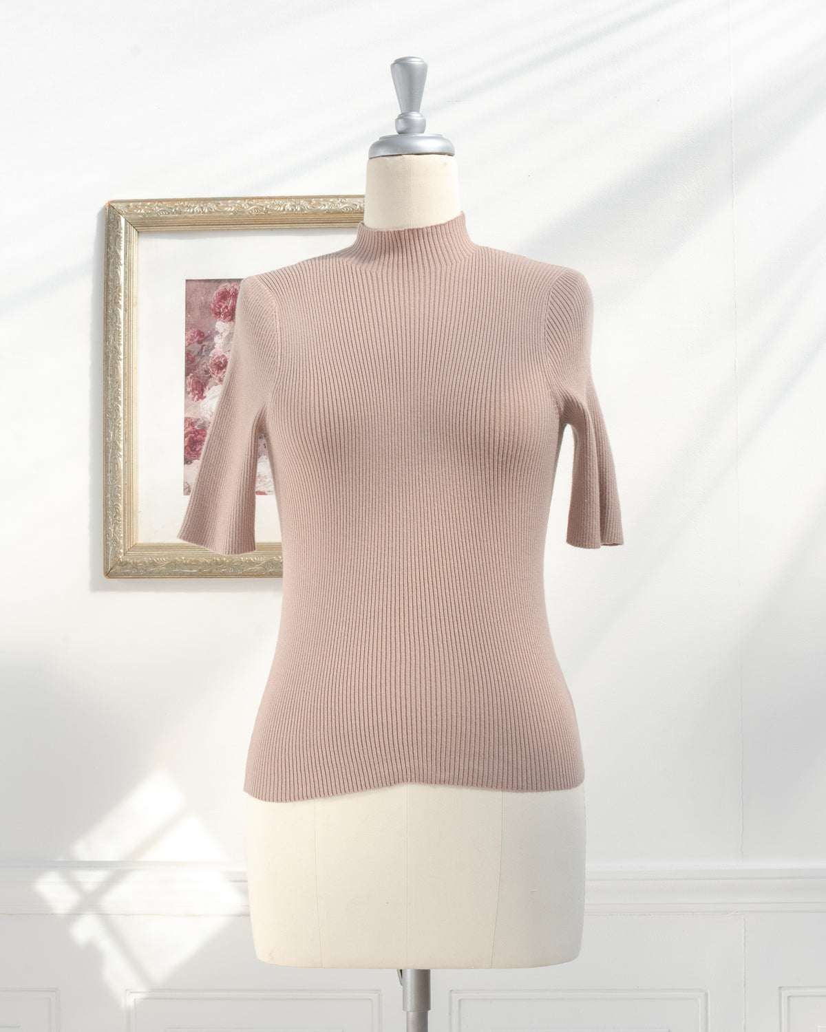 Taupe ribbed knit top with short sleeves and mock neck on a mannequin, French girl style, front view.