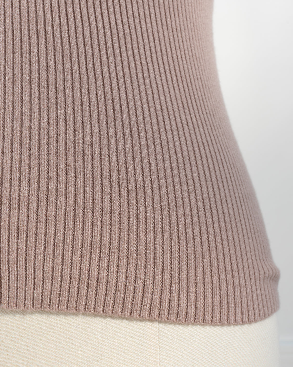 Taupe ribbed knit top with fine vertical ribbing, texture detail view.