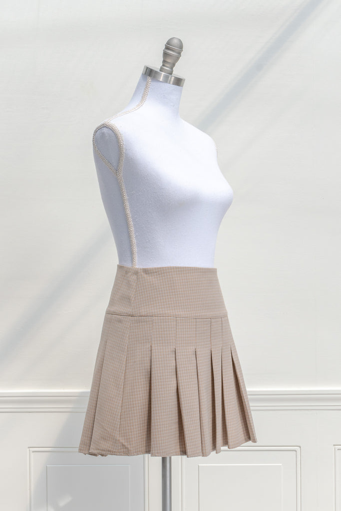 cottagecore mini skirt. box pleat skirt in taupe. front view. 